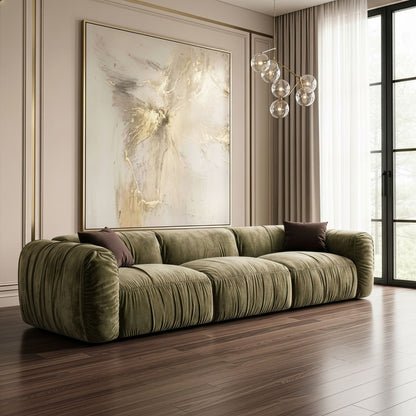 Siegal olive green sofa styled in a modern living room